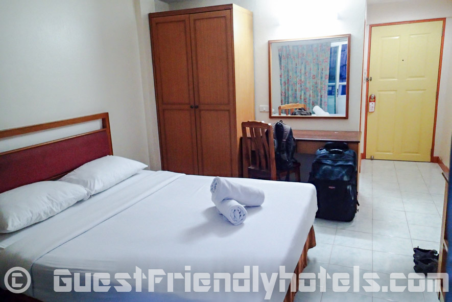 Amenities of the Standard room at the Eastiny Bella Vista Hotel are very basic with wardrobe and small table