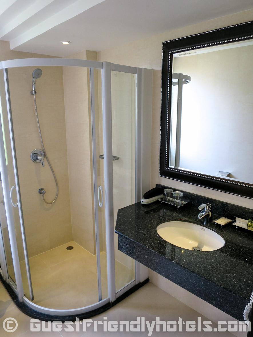 Bathroom shower in standard rooms of the Dawin Bangkok Hotel