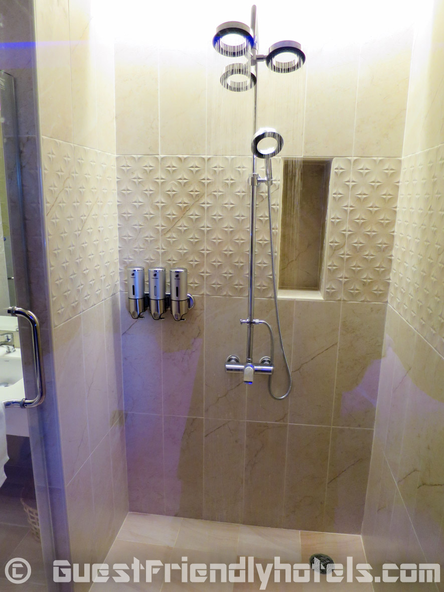 Standard shower head along with an adjustable rainfall shower head inside the bathrooms of Tweet Tweet Nest Pattaya Hotel