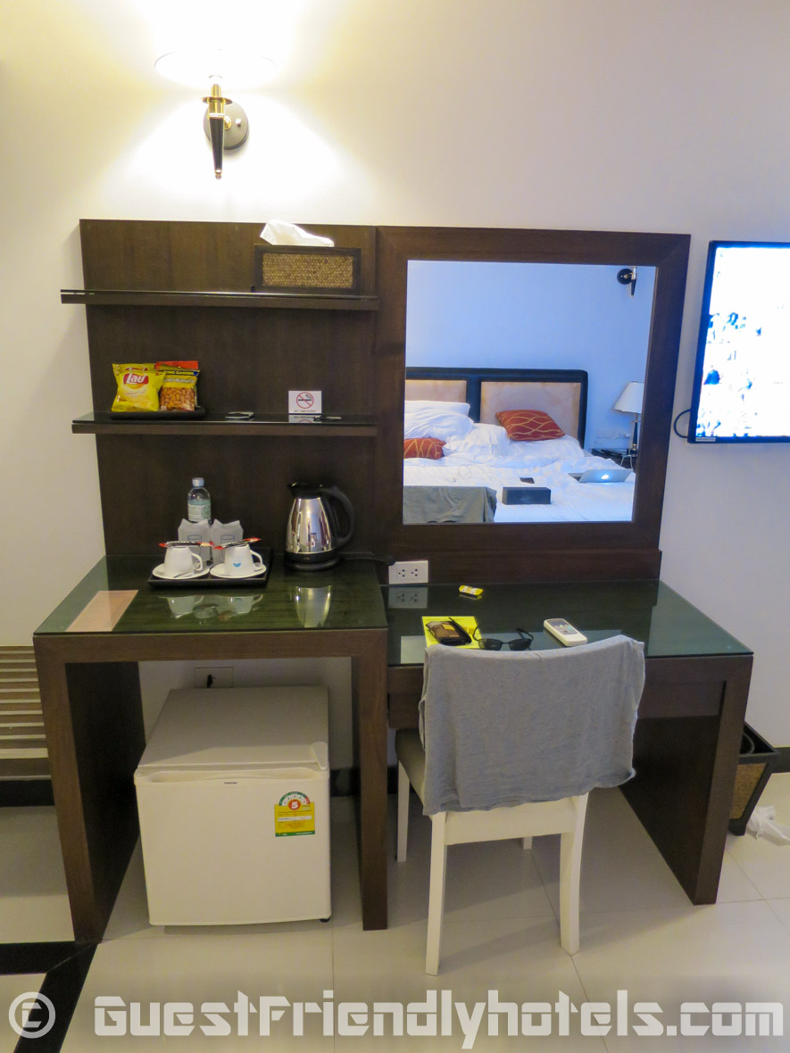 minibar area with small desk inside the superior rooms of the Pattaya Blue Sky Hotel